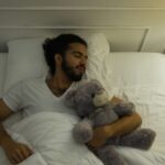 Adults can sleep with stuffed animals, too. It might even be a good thing, experts say